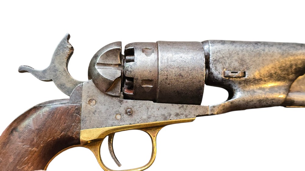 A 19th-century Colt Model 1860 Army percussion revolver featuring a steel barrel, creeping lever mechanism, brass trigger guard, and dark walnut grip. View XXVII