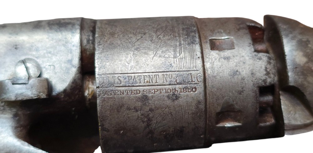 A 19th-century Colt Model 1860 Army percussion revolver featuring a steel barrel, creeping lever mechanism, brass trigger guard, and dark walnut grip. View XXVIII