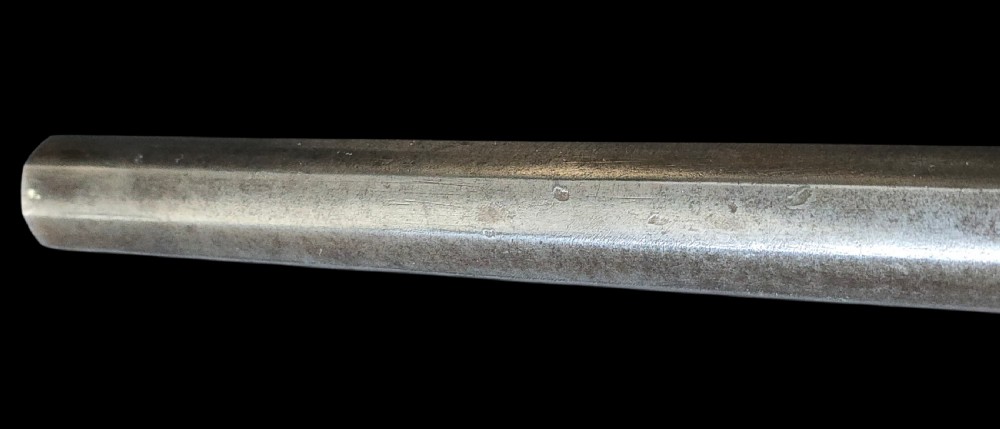 An eighteenth-century Ottoman Balkan flintlock musket carbine with a brass-sheathed stock featuring chased geometric patterns and a steel barrel. View XXIII