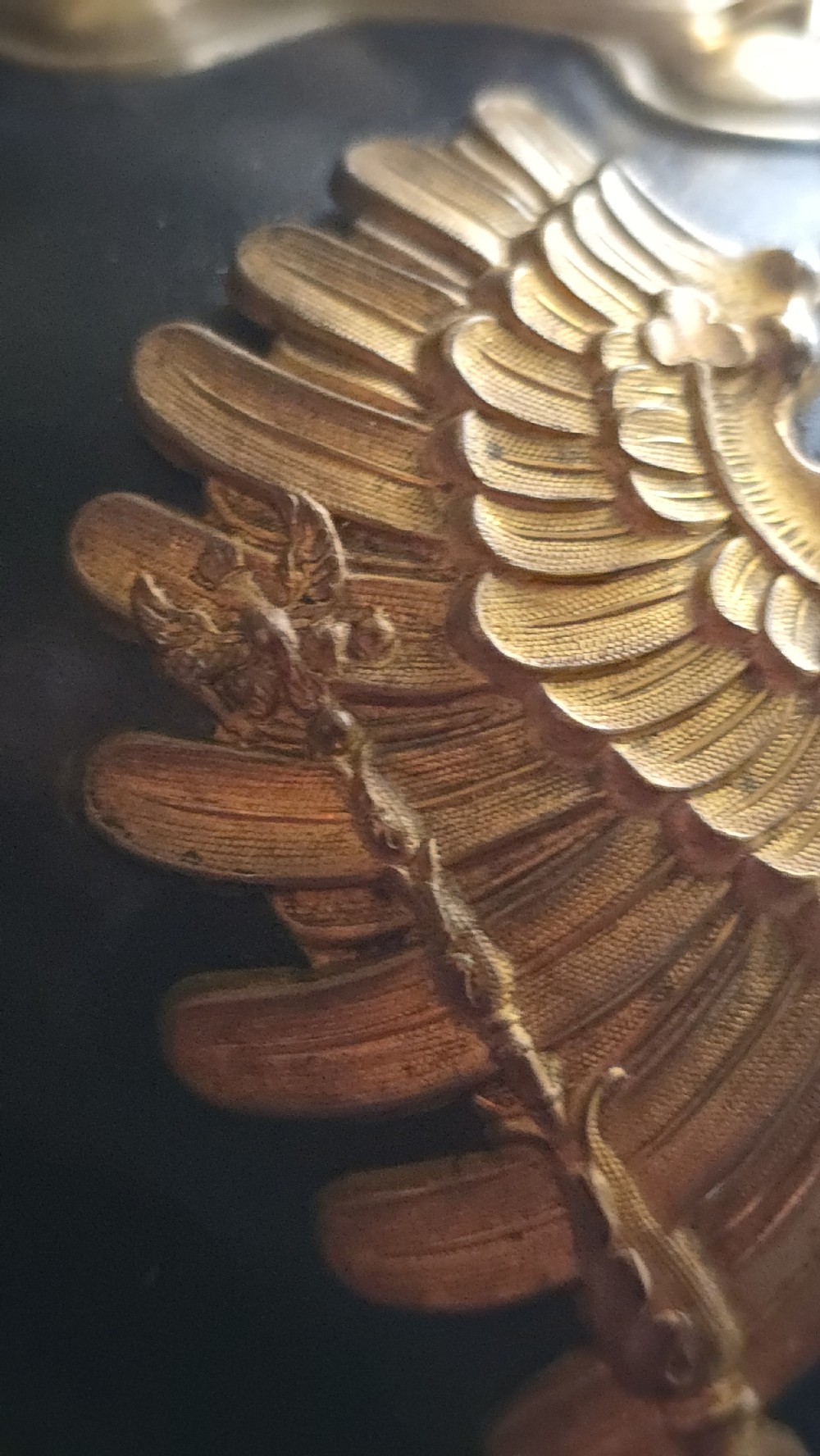An Imperial German Prussian Model 1895 leather Pickelhaube helmet featuring a brass eagle front plate and a tall metal spike. View XIV