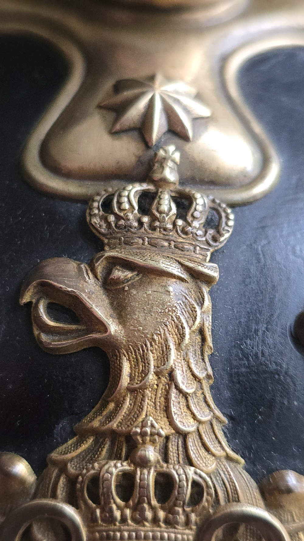 An Imperial German Prussian Model 1895 leather Pickelhaube helmet featuring a brass eagle front plate and a tall metal spike. View XV
