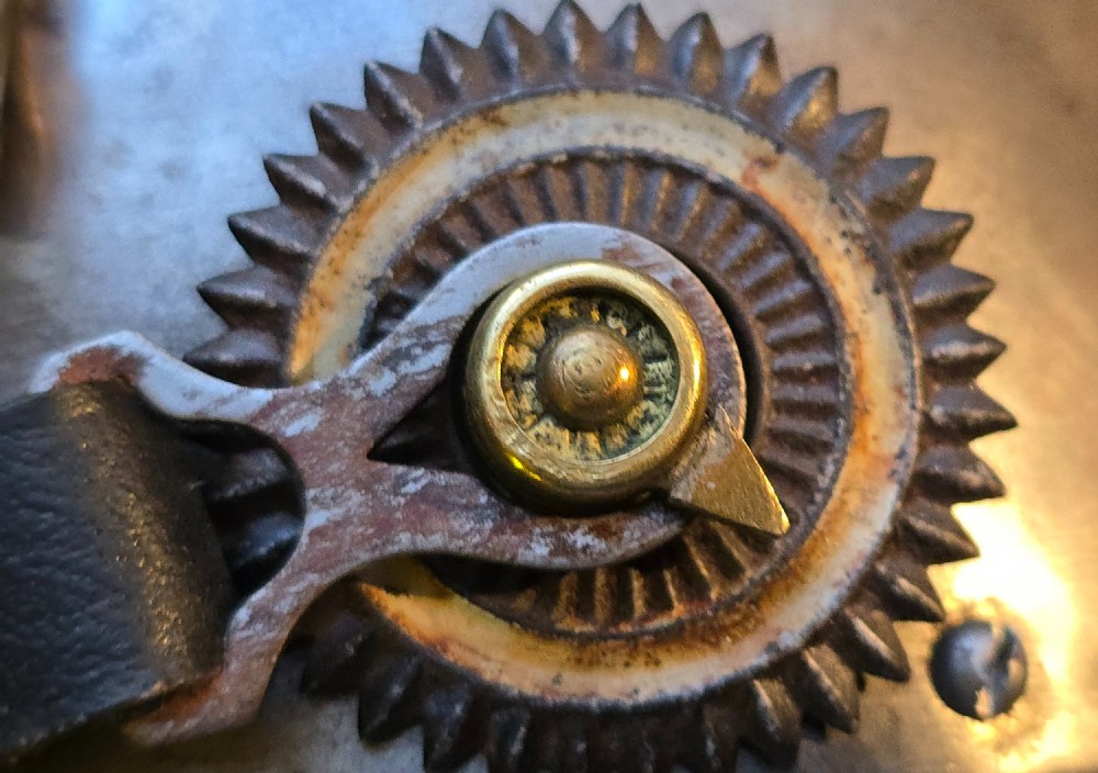 A WWI Prussian steel Pickelhaube helmet featuring a brass spiked top, a brass Prussian eagle emblem on the front, and a black strap. View VIII