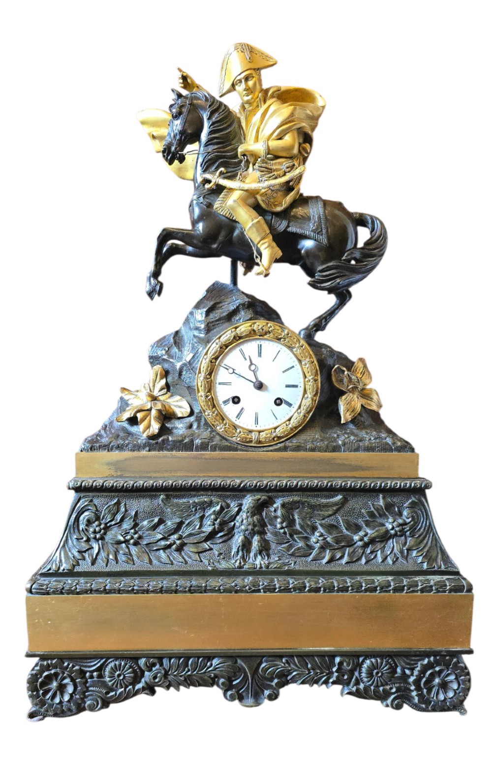 A 19th-century French mantel clock featuring a patinated and gilt bronze equestrian statue of Napoleon Bonaparte atop a base housing a white clock face with Roman numerals.