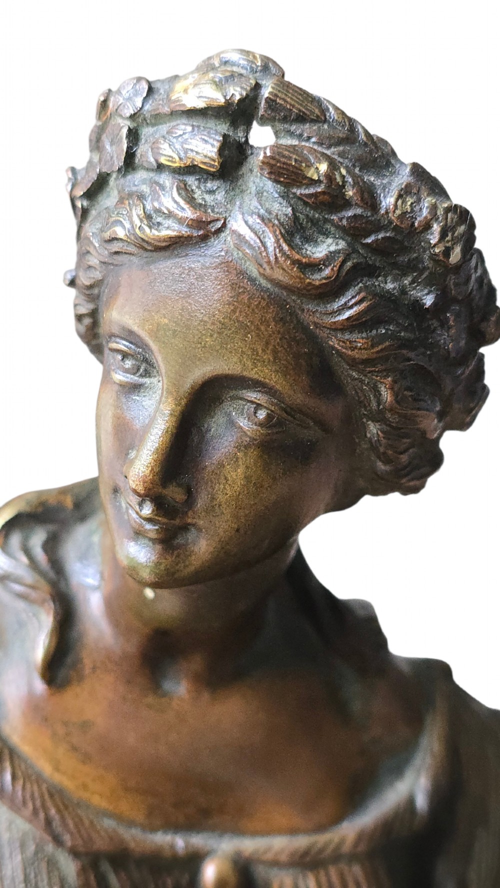 A 19th-century patinated bronze sculpture depicting the classical goddess Demeter seated beside a fluted column on a black stepped plinth. View VI