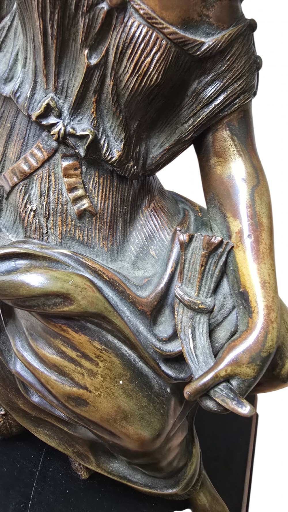 A 19th-century patinated bronze sculpture depicting the classical goddess Demeter seated beside a fluted column on a black stepped plinth. View VII