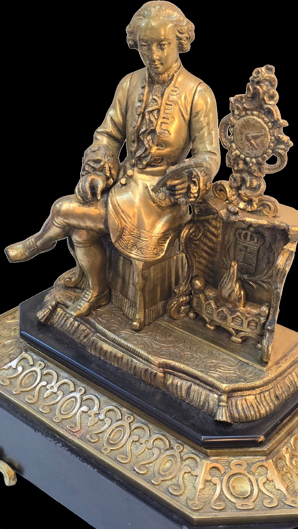 A 19th-century French gilt bronze sculpture depicting a seated gentleman in historic dress holding a quill, supported by an ornate black base with metallic scroll feet. View VI