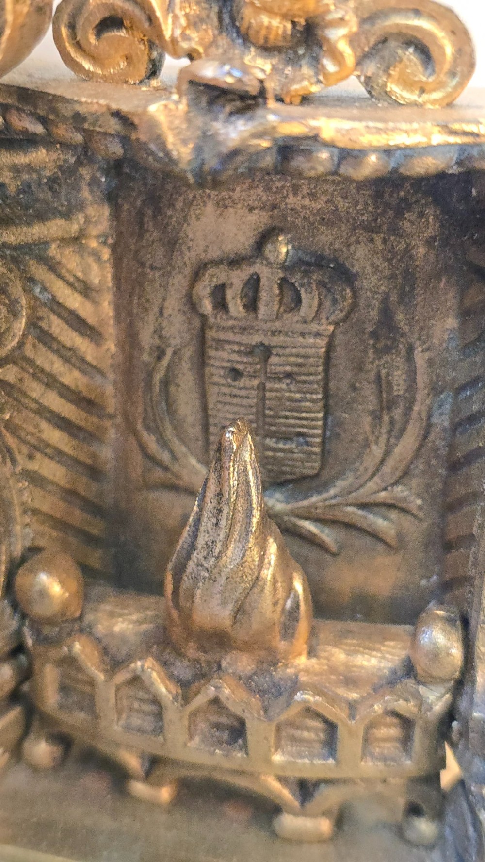 A 19th-century French gilt bronze sculpture depicting a seated gentleman in historic dress holding a quill, supported by an ornate black base with metallic scroll feet. View VII