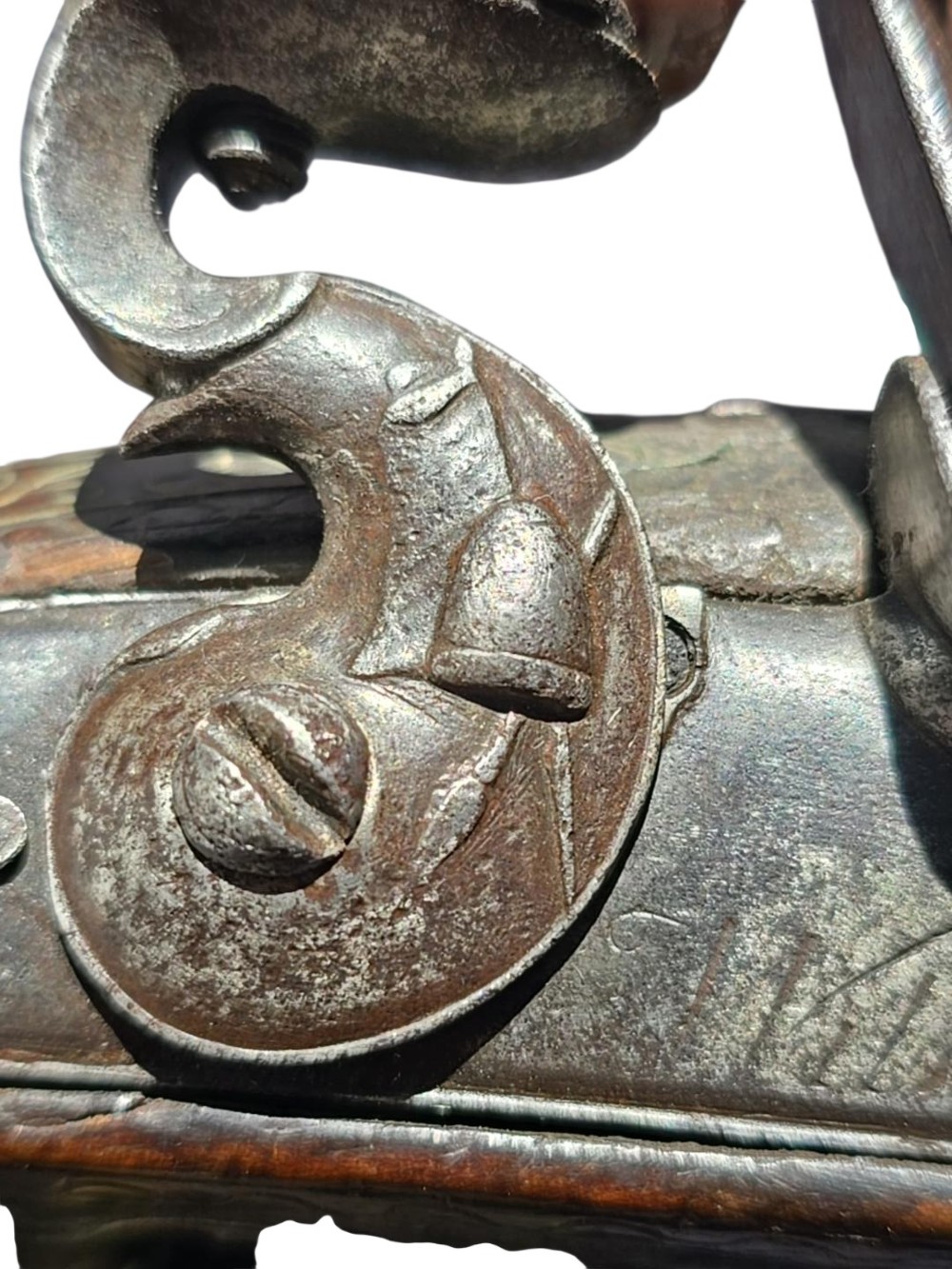 An early 19th-century Ottoman Balkan flintlock holster pistol featuring a dark wood stock inlaid with silver wire scrollwork and a cast brass pommel. View XV