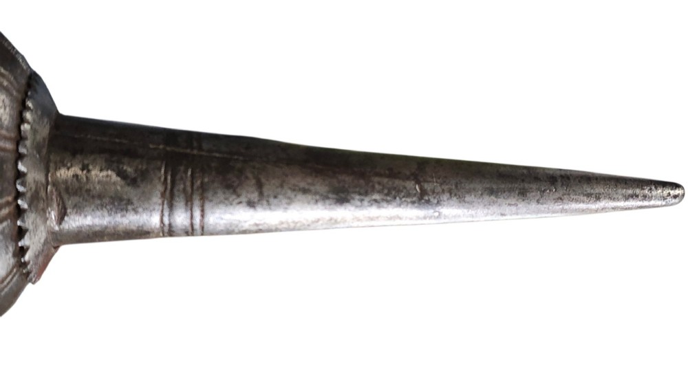 A 17th-century forged iron spear butt with a tapered spike and two ribbed knops, mounted vertically on a dark square stand. View VI
