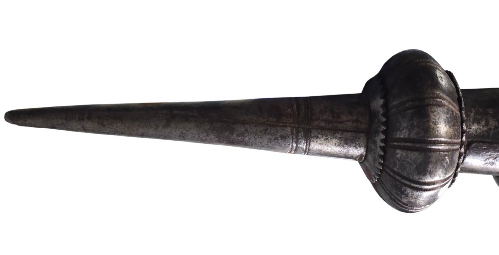 A 17th-century forged iron spear butt with a tapered spike and two ribbed knops, mounted vertically on a dark square stand. View XI