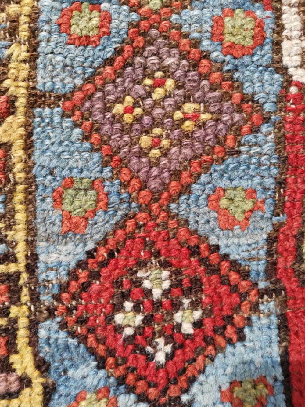 A hand-knotted antique Anatolian Konya prayer rug featuring a red mihrab arch motif, central tree pattern, and geometric multi-coloured borders. View V