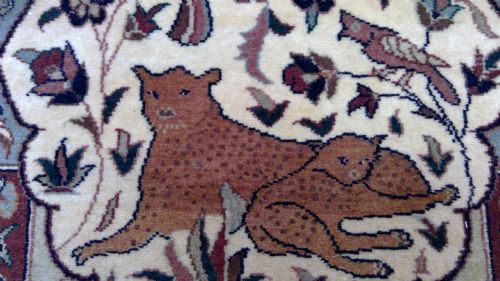  persian carpet of fantastic quality decorated with animals ,exotic plants flowers and birds on an ivory ground with vibrant hues