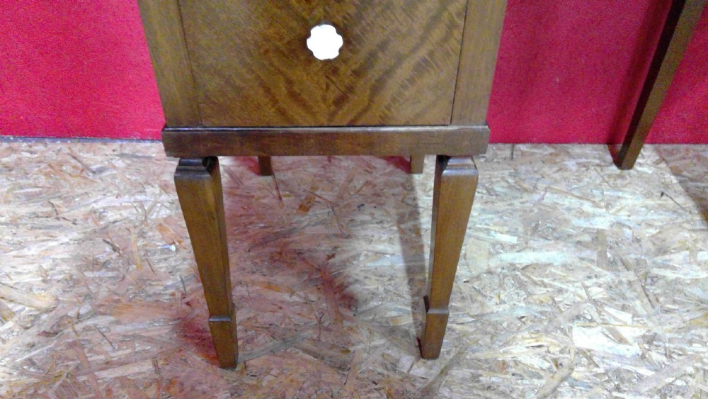 An Art Deco mahogany dressing table featuring a central mirror flanked by two adjustable wing mirrors, geometric wood inlays, and small white drawer knobs. View II