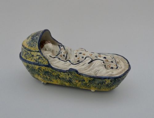 Large Staffordshire Prattware Child in a Cradle, C. 1800.