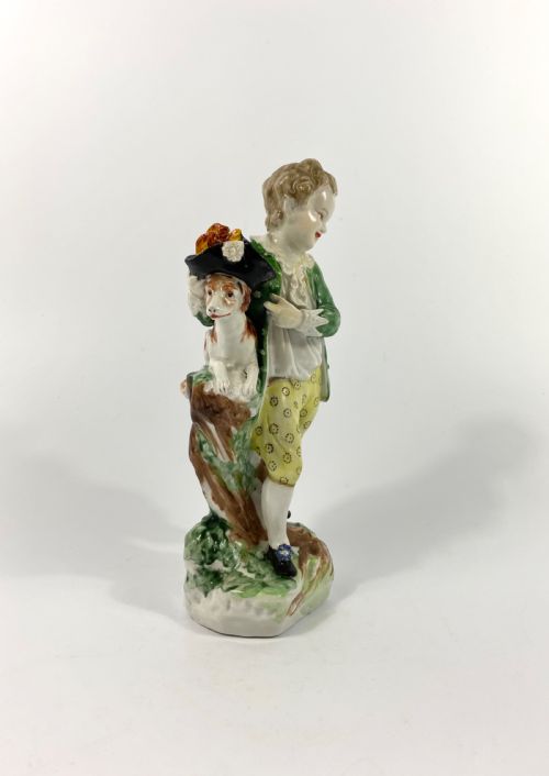 fig 1. Bristol porcelain figure of a boy with his dog, c. 1775.