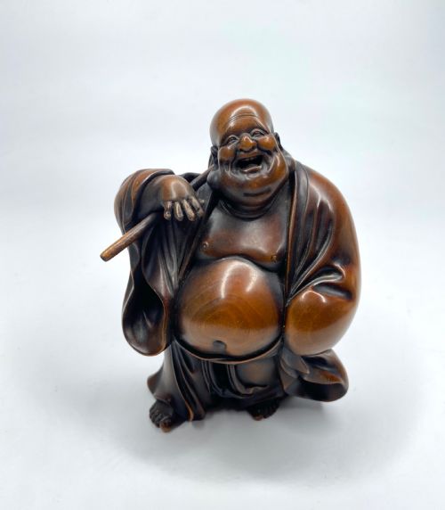 Hotei, a Boxwood Carved Okimono, Meiji Period.
