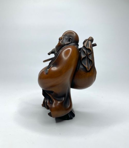 fig 1. Hotei, a boxwood carved okimono, Meiji Period.