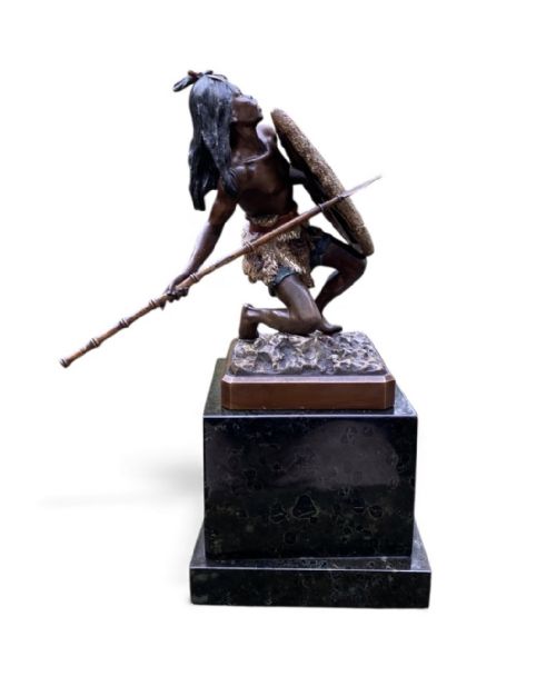 fig 1. A cold-painted Vienna bronze figurine depicting an African warrior holding a textured shield and spear, created around 1900.