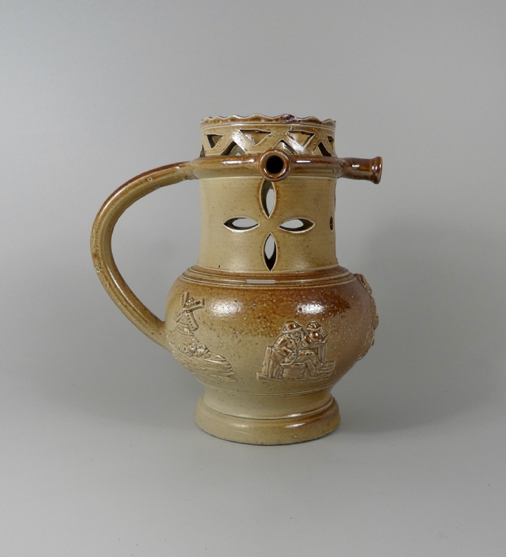 Brampton saltglazed stoneware puzzle jug, c. 1840.
