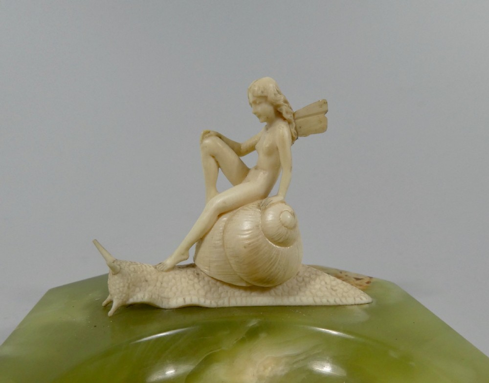 Fairy riding a snail. Art Deco ivory group, after Ferdinand Preiss, c. 1920.