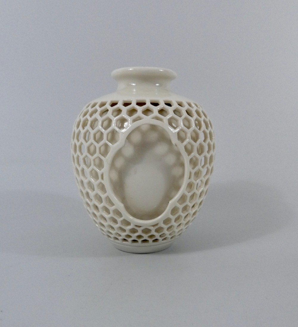 Royal Worcester reticulated porcelain vase, dated 1909.