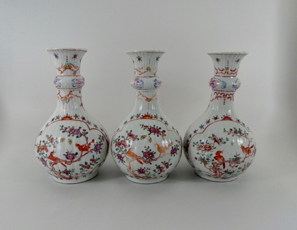 Chinese garniture of vases. Famille rose decoration. Qianlong Period.