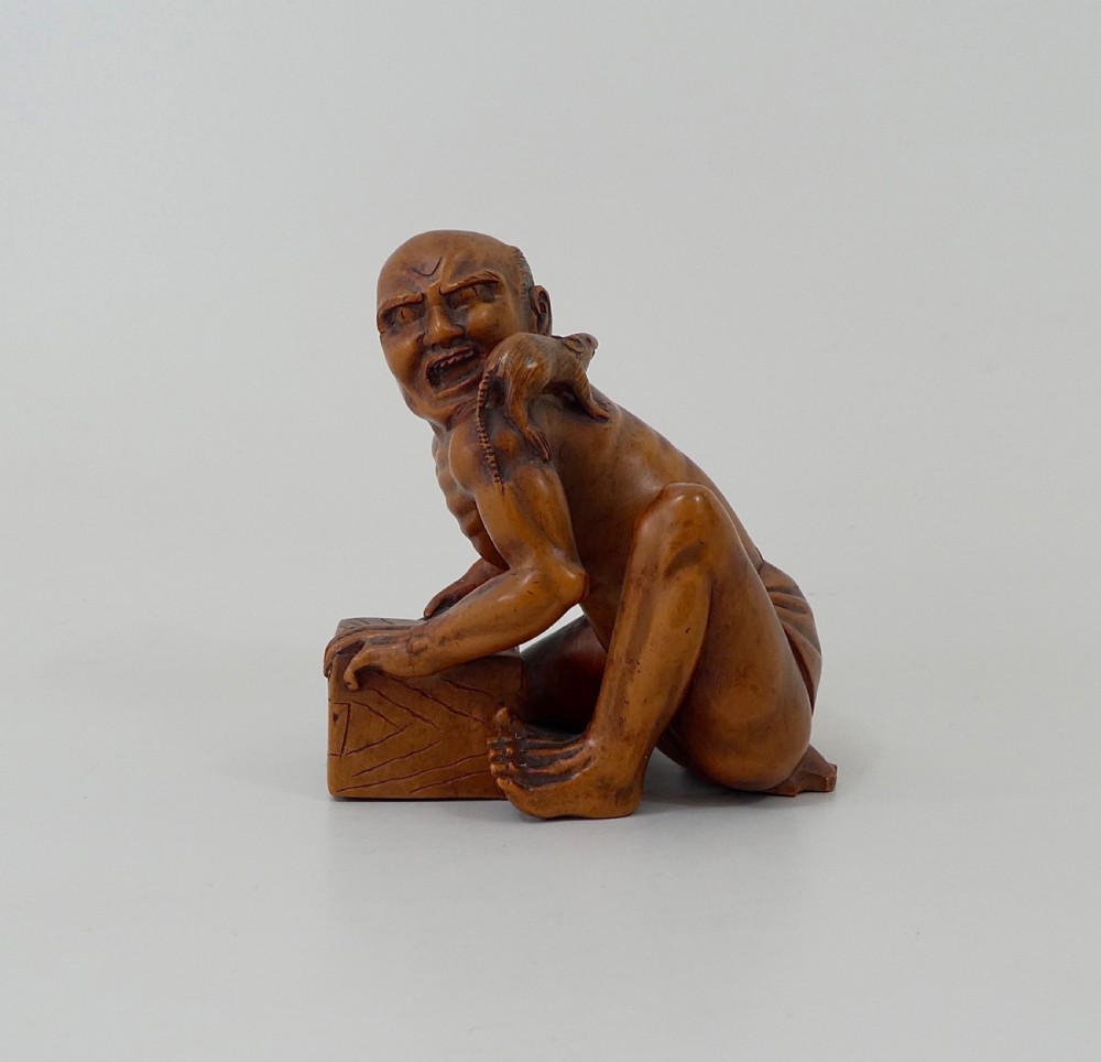 Japanese boxwood okimono ‘The Rat Catcher’. Meiji Period.