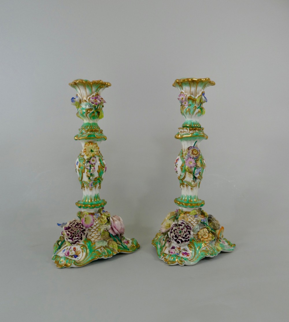 Pair Coalport flower encrusted porcelain candlesticks, c. 1830. View V