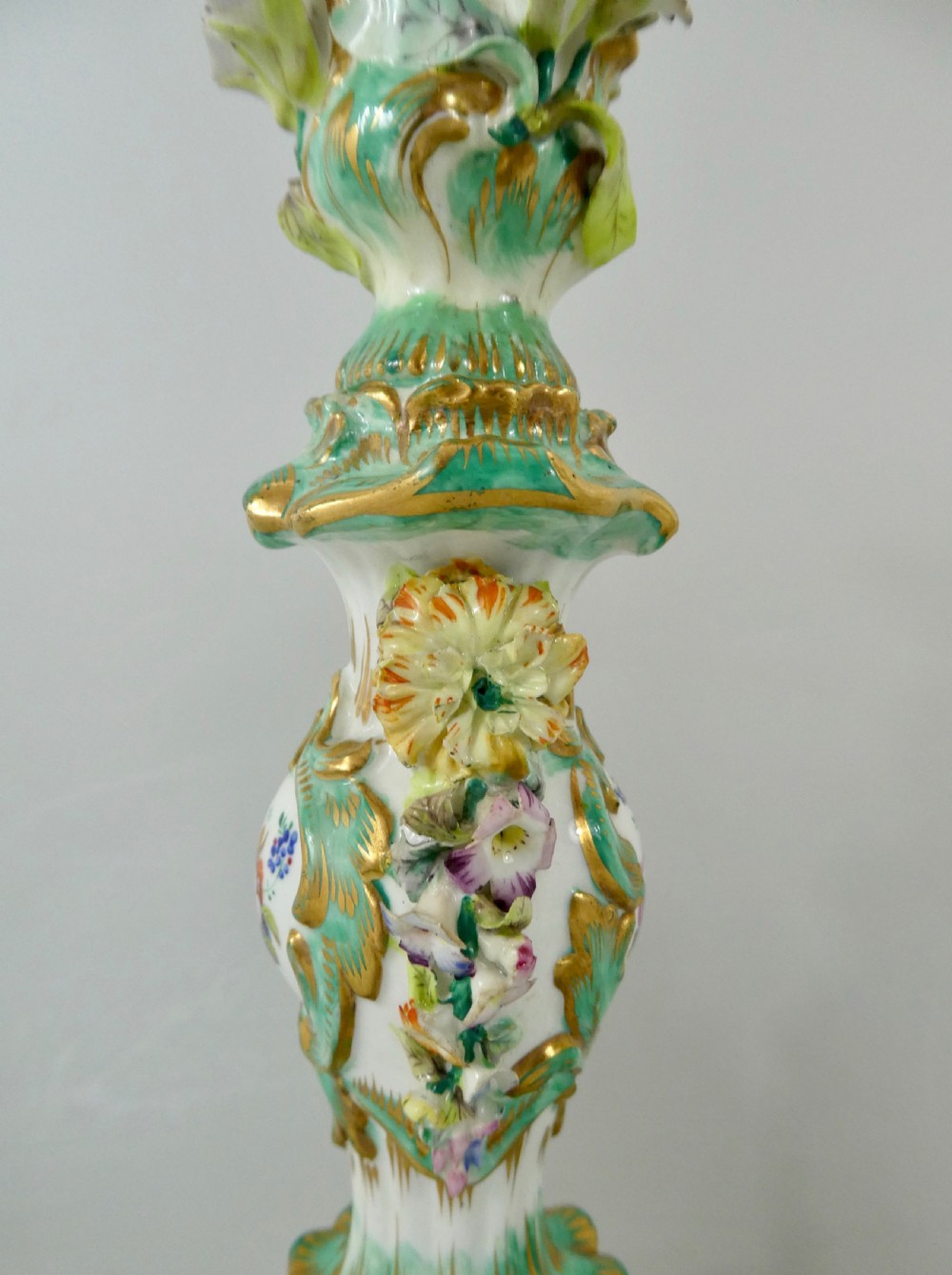 Pair Coalport flower encrusted porcelain candlesticks, c. 1830. View VI