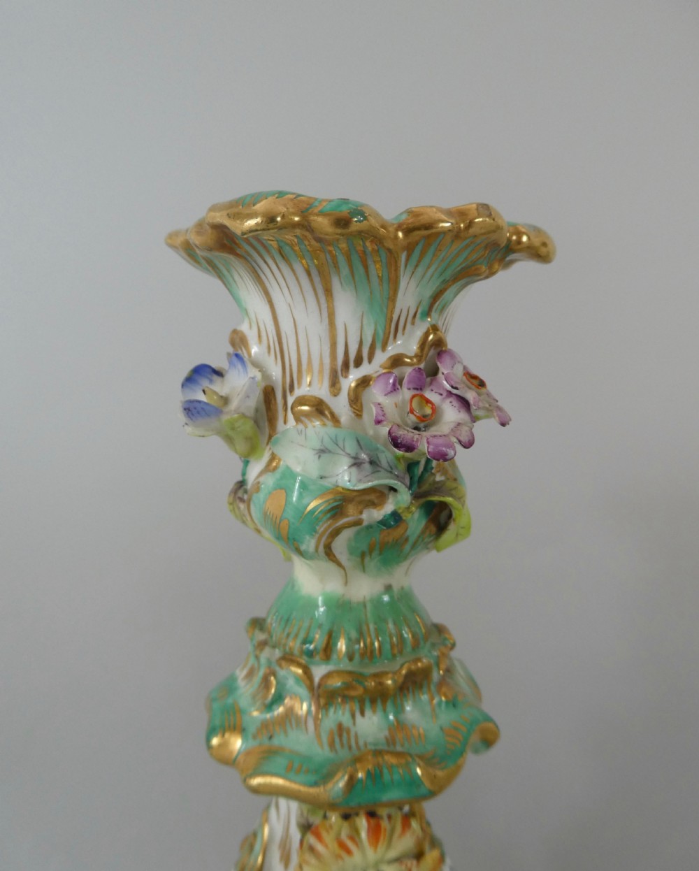 Pair Coalport flower encrusted porcelain candlesticks, c. 1830. View VII