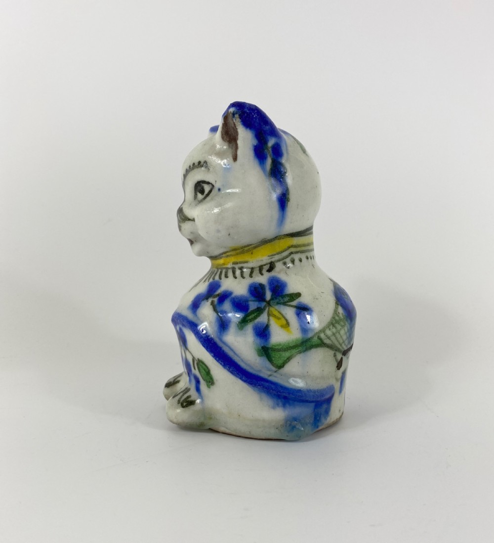 Qajar pottery seated cat. Iran, c. 1890. View IV
