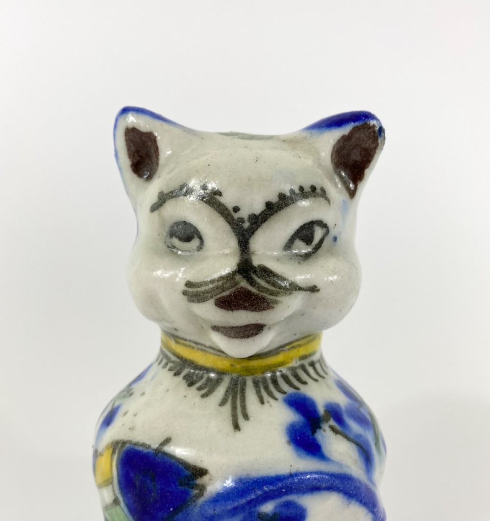 Qajar pottery seated cat. Iran, c. 1890. View V