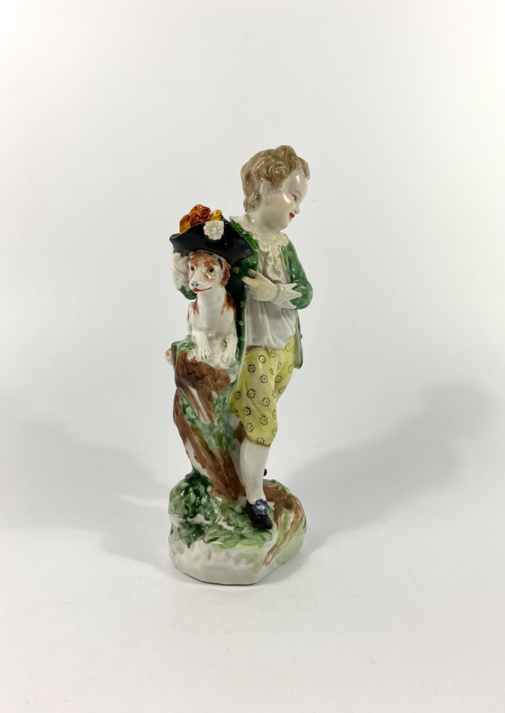 Bristol porcelain figure of a boy with his dog, c. 1775. View II