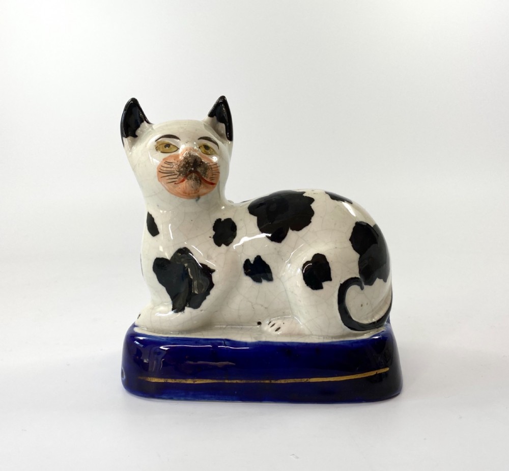 Staffordshire pottery recumbent cat, c. 1850.