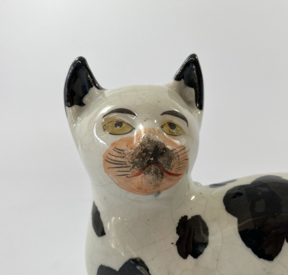 Staffordshire pottery recumbent cat, c. 1850. View II