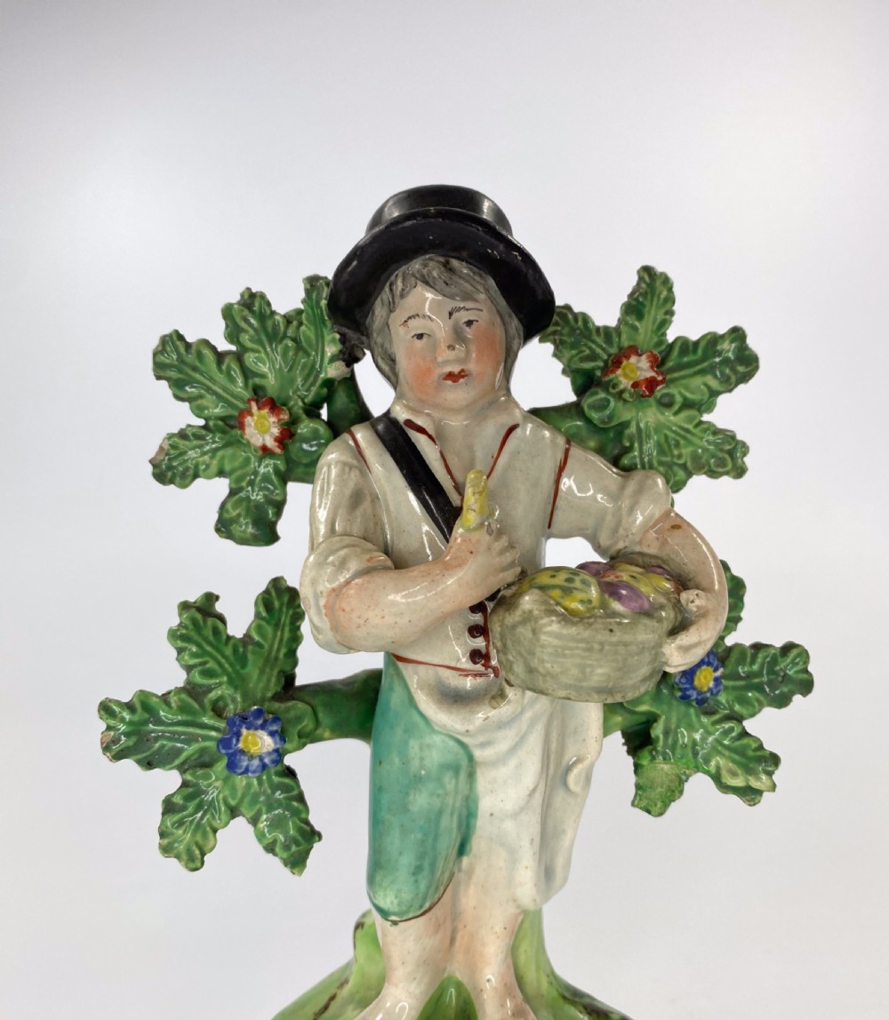 Walton pottery bocage figure. Fruit gatherer, c. 1820. View II
