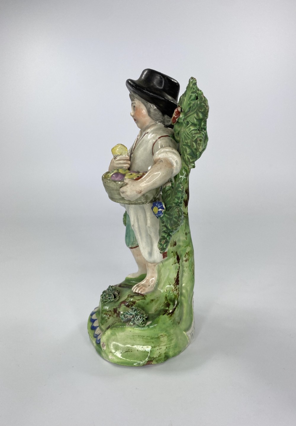 Walton pottery bocage figure. Fruit gatherer, c. 1820. View V