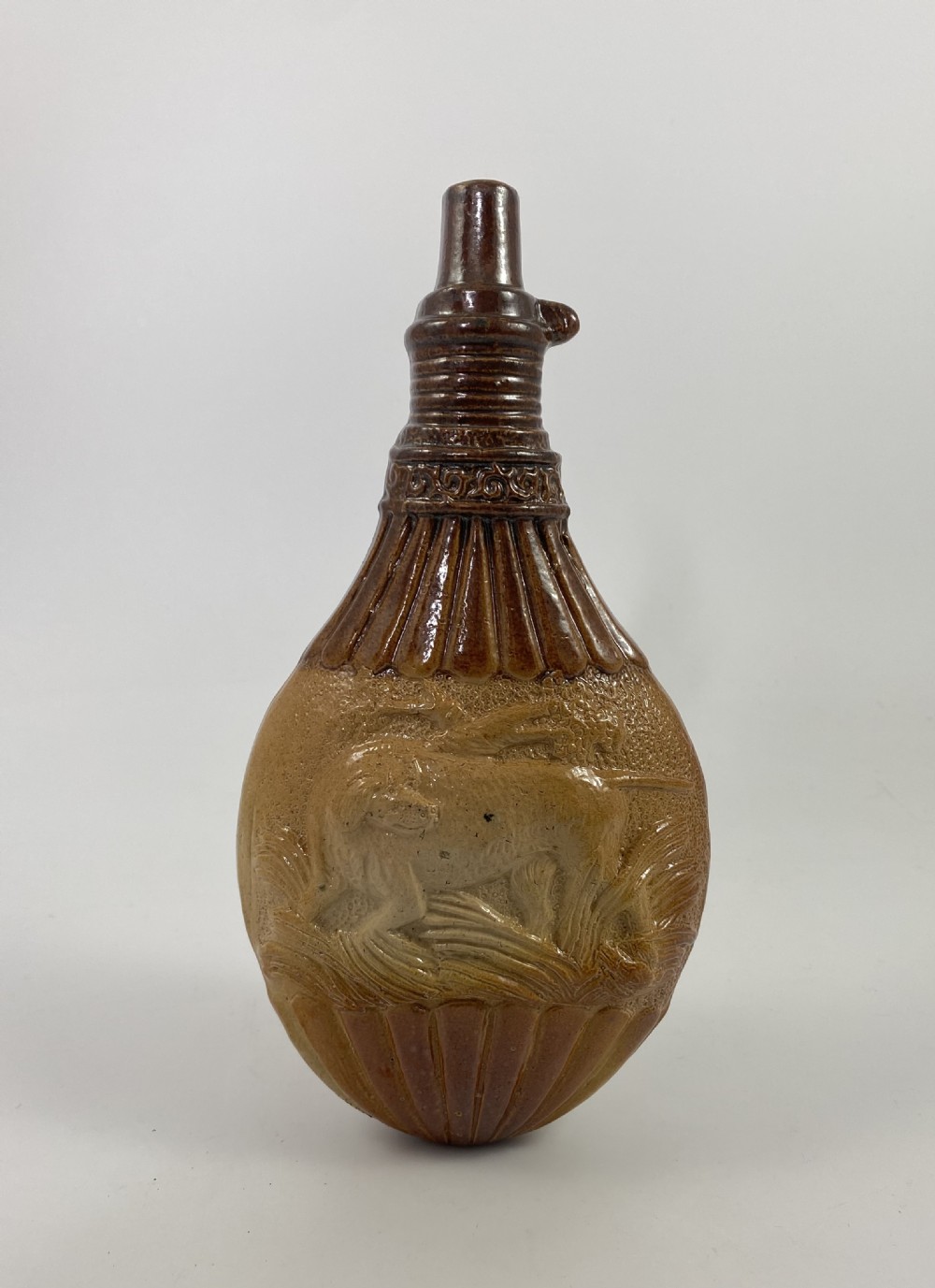 Lambeth Saltglaze stoneware spirit flask, c. 1840.