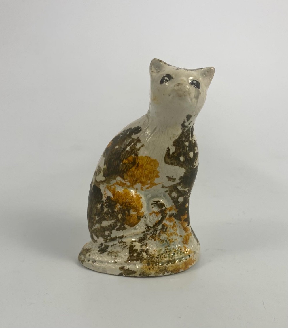 Staffordshire pottery cat. Pratt glazes, c. 1800.
