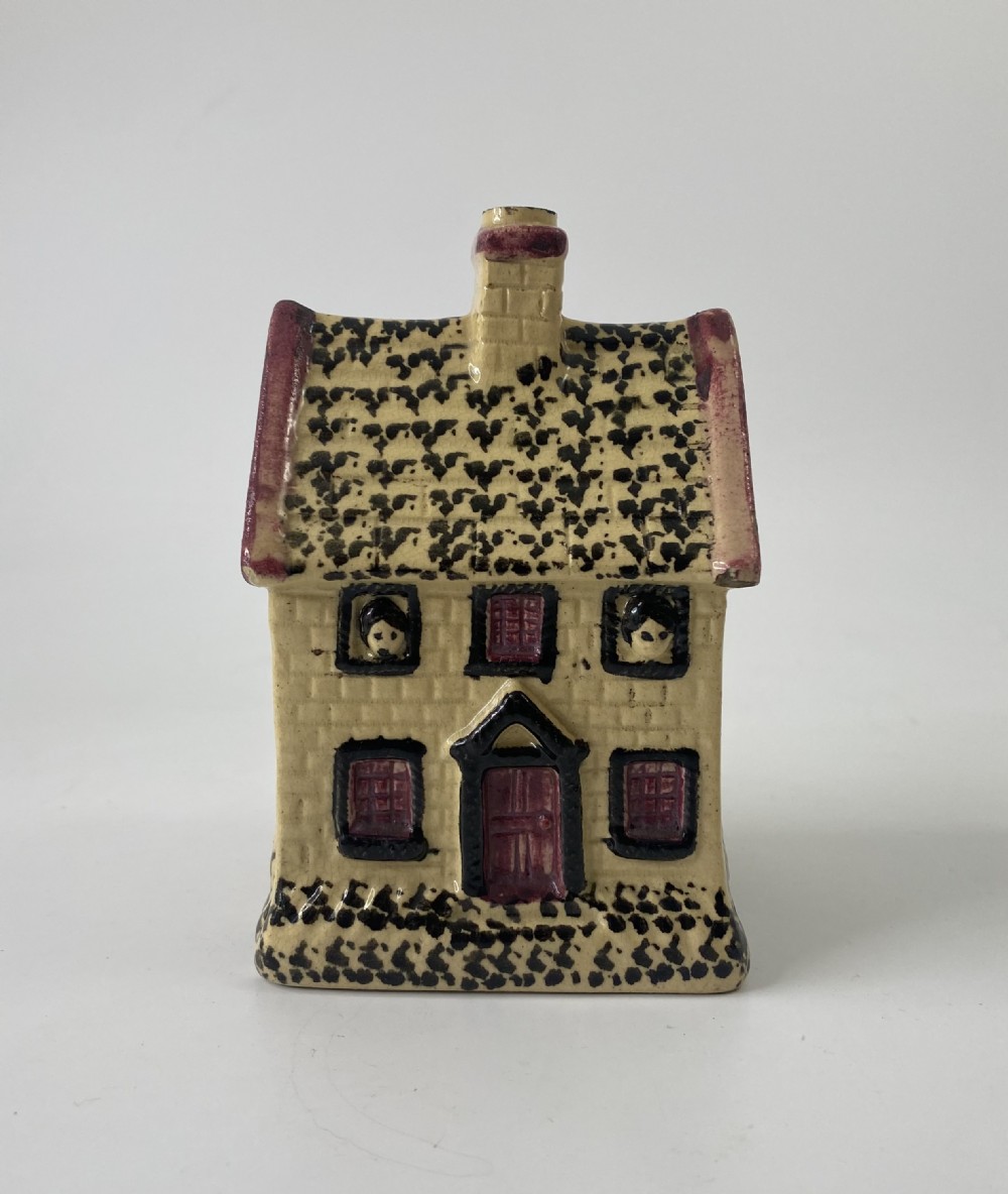 English Prattware cottage money box, c. 1830.