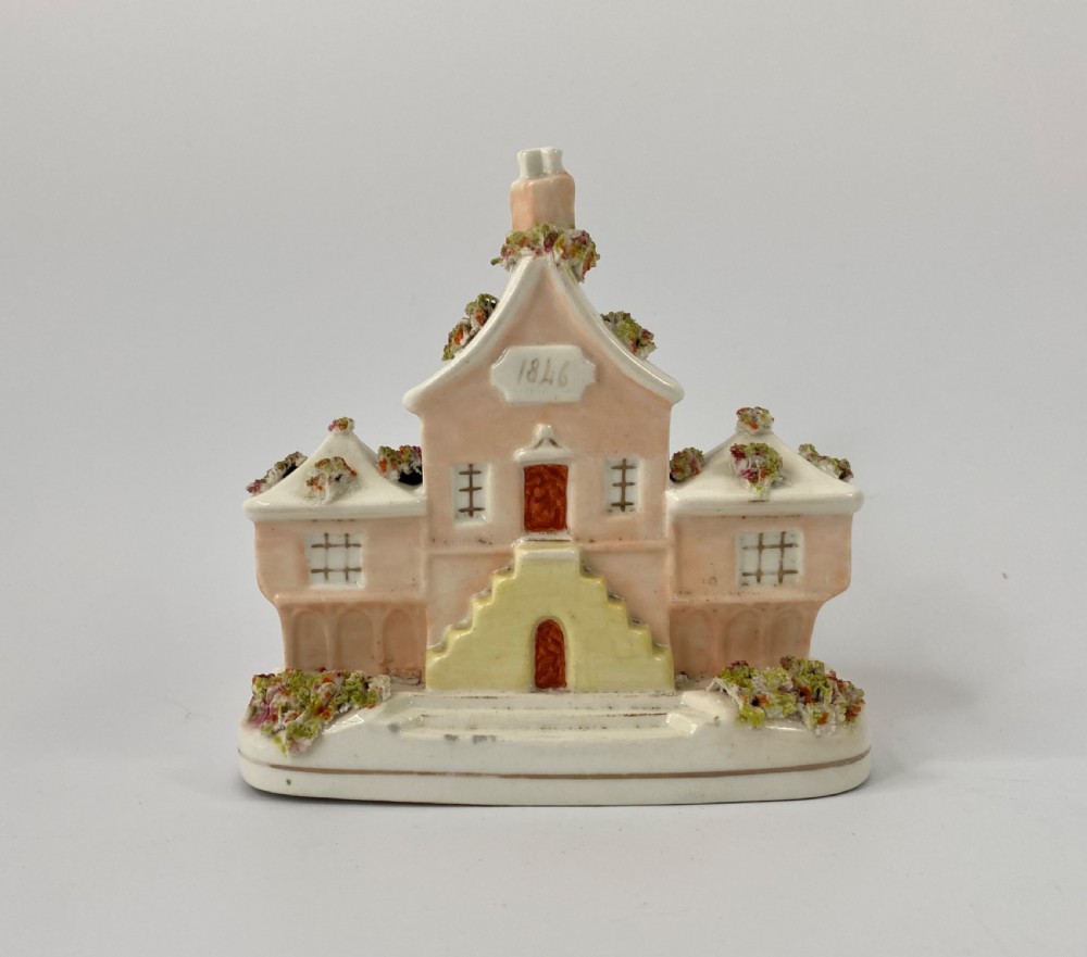 Staffordshire porcelaneous cottage, dated 1846.