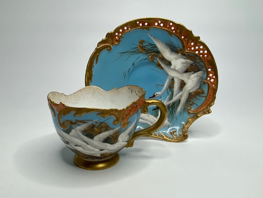 Royal Worcester cup and saucer. Swans, Charley Baldwyn, d. 1907.