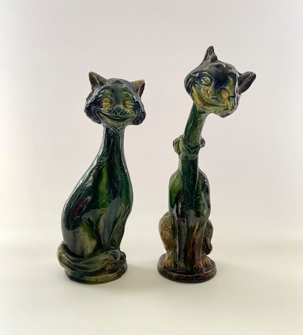 Pair Arts & Crafts pottery Cat candlesticks, c. 1910.