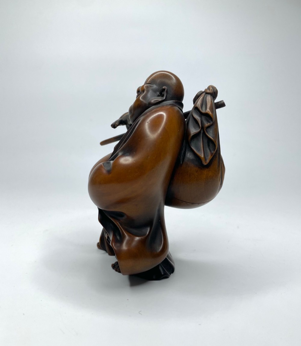 Hotei, a boxwood carved okimono, Meiji Period. View II