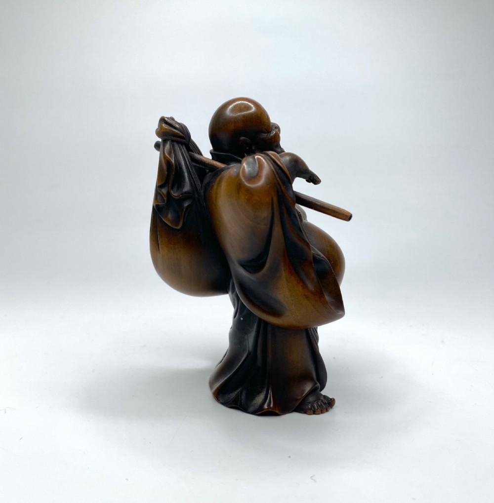 Hotei, a boxwood carved okimono, Meiji Period. View IV