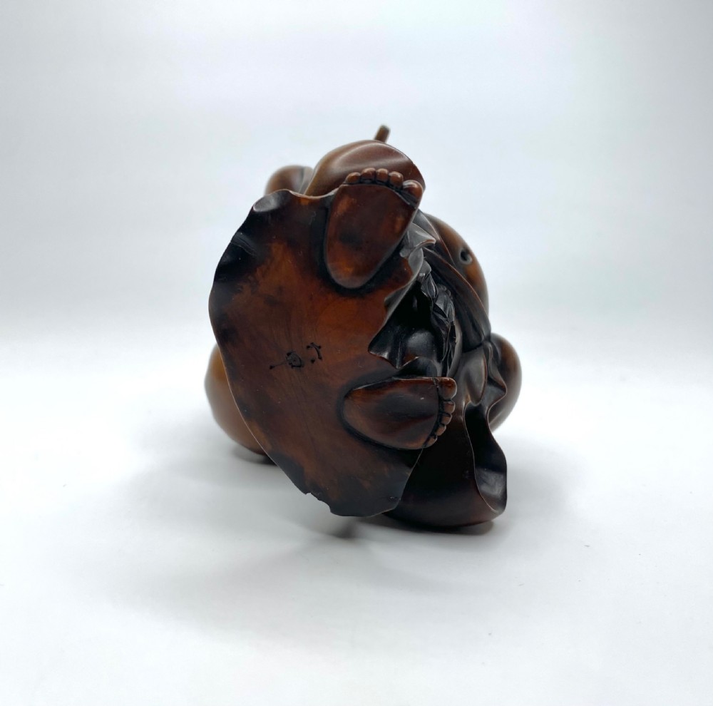 Hotei, a boxwood carved okimono, Meiji Period. View V