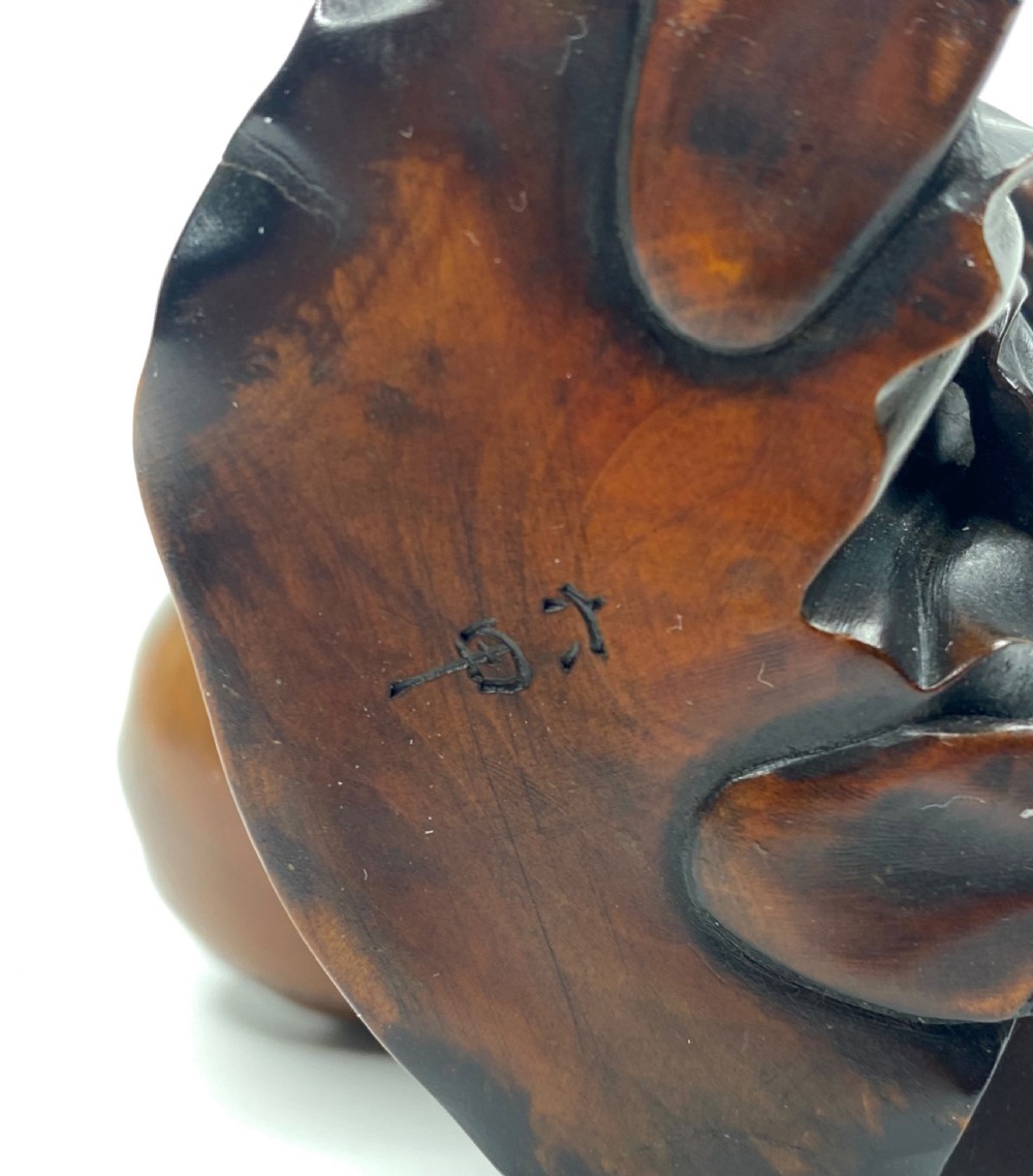 Hotei, a boxwood carved okimono, Meiji Period. View VI