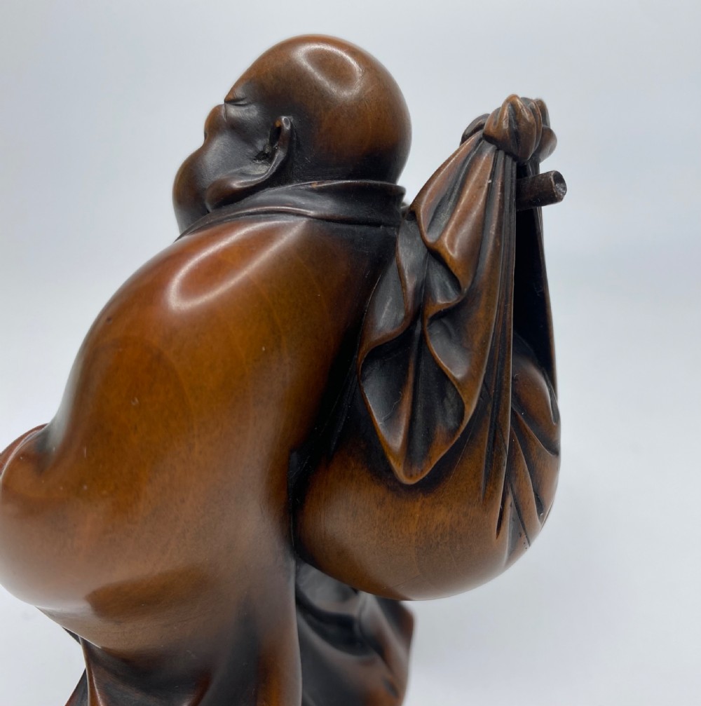 Hotei, a boxwood carved okimono, Meiji Period. View IX
