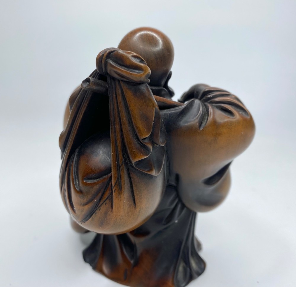 Hotei, a boxwood carved okimono, Meiji Period. View X