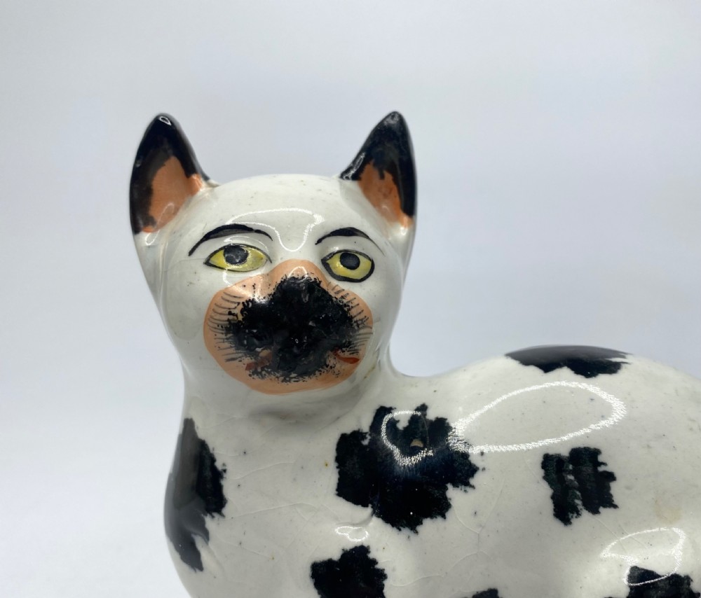 Staffordshire pottery recumbent cat, c. 1850. View V